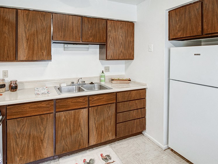 Kitchen at Carriage House East with white appliances and plenty of cabinetry.